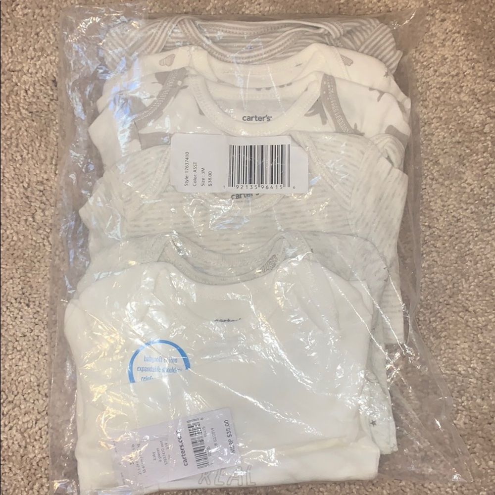 NWT, never opened, 6 long sleeve Carter's onesies